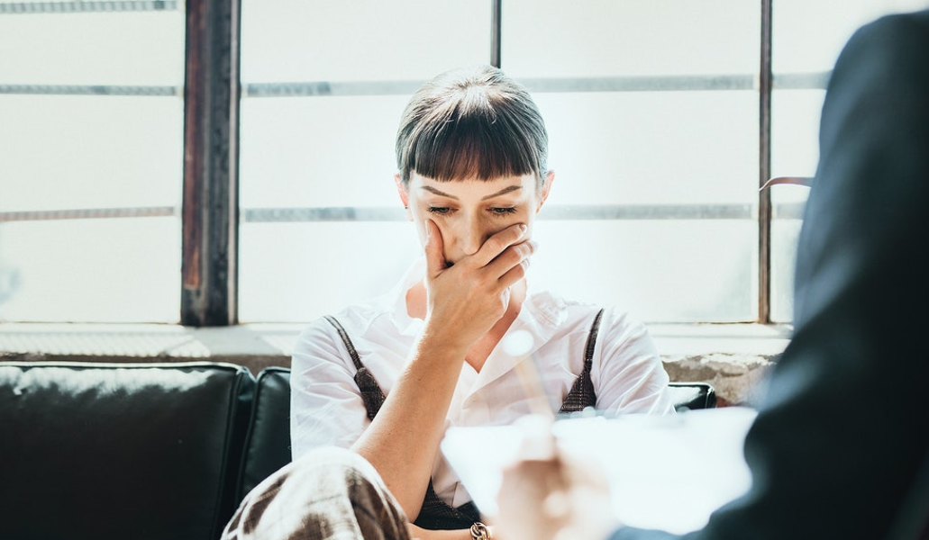 business woman covering his mouth in serious face